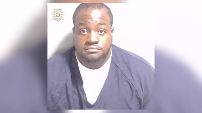 Monique Clark was fired from his job as a correctional officer with the Fulton County Sheriff's Office after he was arrested on charges of assaulting a detainee during a custody exchange, Sheriff Pat Labatt said.