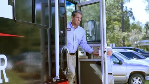 GOP candidate for governor Brian Kemp steps out of his campaign bus during a tour of the state last week. RYON HORNE / RHORNE@AJC.COM