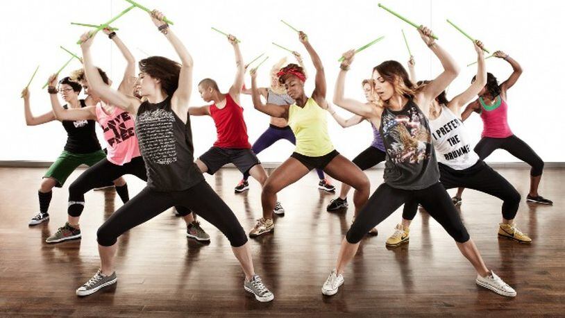 POUND fitness classes utilize weighted drumsticks in an intense calorie-burning workout.