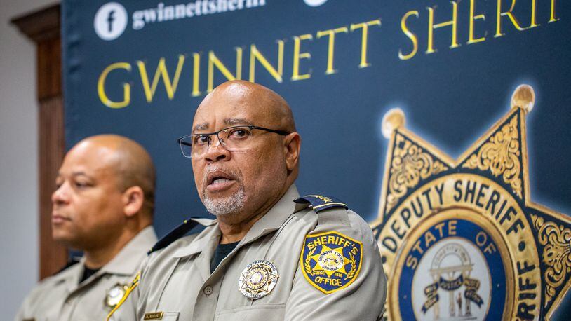 Gwinnett County Sheriff Keybo Taylor, right, addresses the press at the Gwinnett Sheriff's Office in Lawrenceville with Chief Cleophas Atwater, left, at his back, on Tuesday, June 29, 2021.  Sheriff Taylor addresses an extortion lawsuit against him initiated by staff at a bail bonds company which has concluded, the bond service has retracted the lawsuit.  (Jenni Girtman for The Atlanta Journal-Constitution