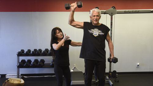 Personal trainer Linda Knowles, left, helps John Gossett with a balance exercise at Linda’s Forever Fit in Dallas on Friday, April 8, 2016. (Rex C. Curry/Dallas Morning News/TNS)