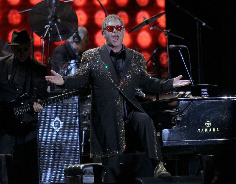 September 18, 2015 - ATLANTA - The legendary Sir Elton John greets the audience at the opening of his performance at the 2015 annual Music Midtown music festival on Friday, September 18, 2015. (Akili-Casundria Ramsess/Special to the AJC)
