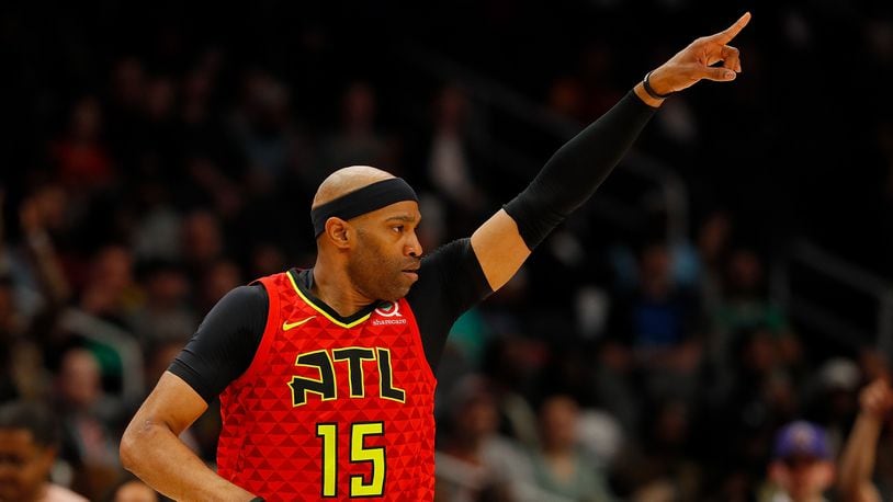 Vince Carter  of the Atlanta Hawks reacts after hitting a three-point basket against the Memphis Grizzlies in the first half at State Farm Arena on March 13, 2019 in Atlanta, Georgia.