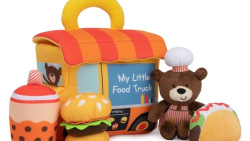 A five-piece food truck playset features sensory-stimulating toys and a convenient carry handle.
(Courtesy of GUND)