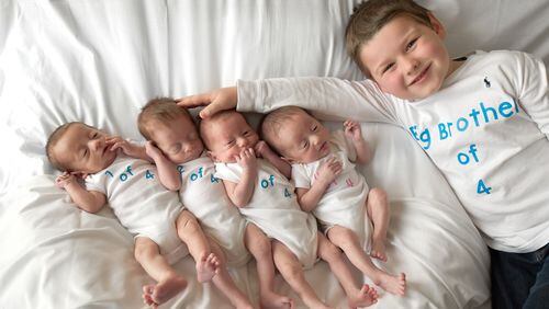 Bentlee, the big brother is a big help and all smiles with his four younger siblings! CONTRIBUTED