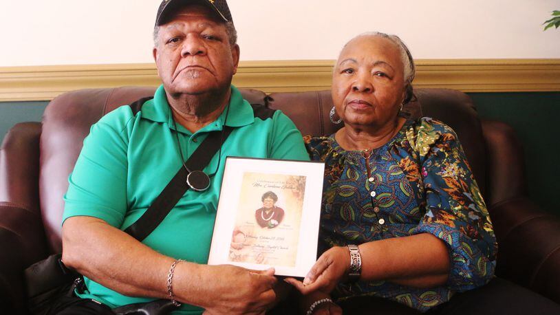 John Golden and his wife hold up the funeral program for his mother, Curliene Golden, at a press conference on Tuesday, July 9, 2019, in Jonesboro, Ga., where Golden and his attorney, Terance Madden, discussed an alleged sexual assault of Golden’s mother at Governor’s Glen Assisted Living Facility in Clayton County. On September 5, 2018, Curliene Golden, a 94-year-old woman, communicated that she was assaulted/raped. No one has been charged and the family is offering an award for more information. Golden has since died. (photo credit: Christina Matacotta/Christina.Matacotta@ajc.com)