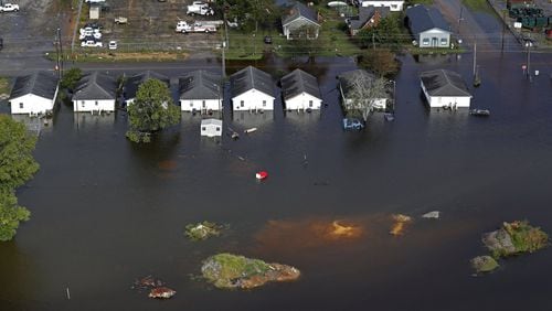 Floodwater from Hurricane Florence threatens homes in Dillon, S.C., Monday, Sept. 17, 2018. (AP Photo/Gerald Herbert)