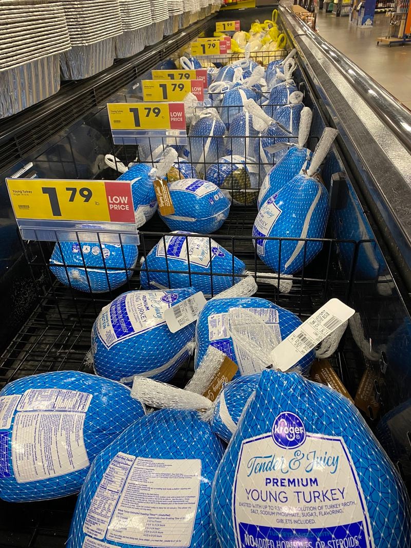 A cooler at the Kroger on Peachtree Road in Brookhaven is stocked with small and large whole frozen turkeys priced at $1.79 per pound. (Ligaya Figueras / ligaya.figueras@ajc.com)