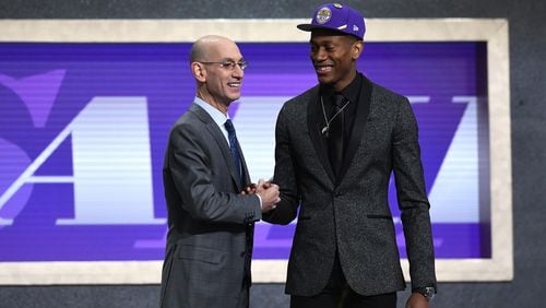 De'Andre Hunter poses with NBA Commissioner Adam Silver after being drafted with the fourth overall pick by the Los Angeles Lakers during the 2019 NBA Draft at the Barclays Center on June 20, 2019 in the Brooklyn borough of New York City.