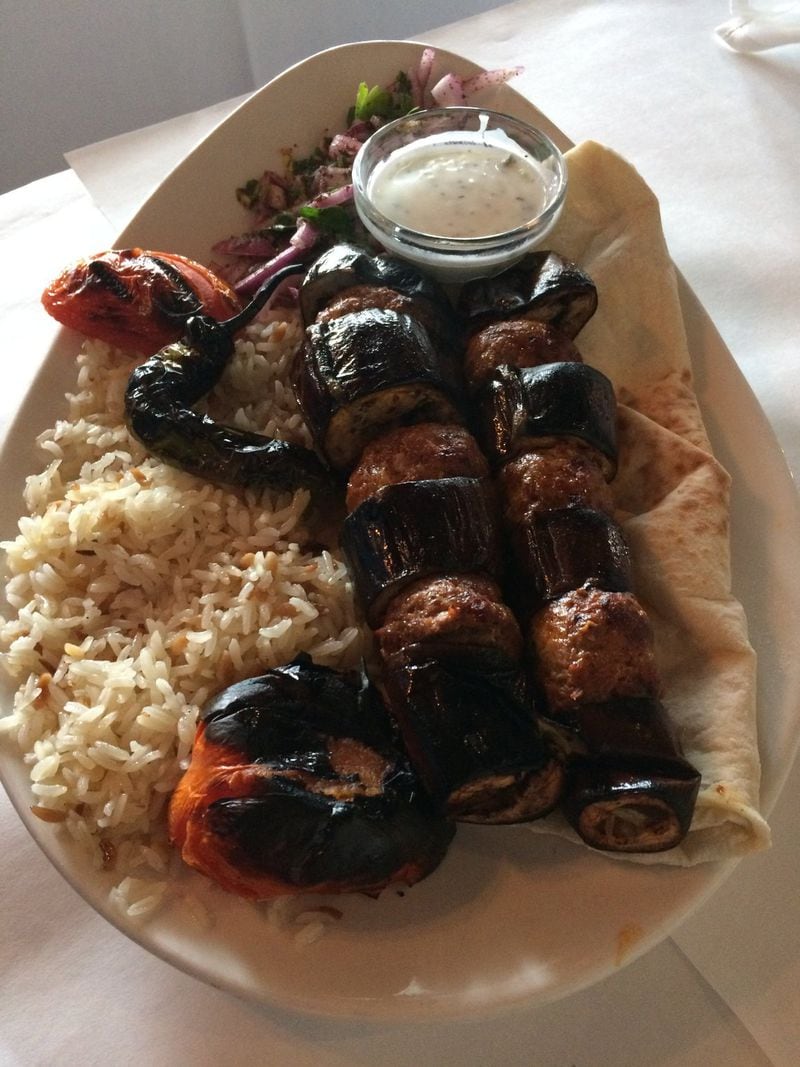 The eggplant kebabs at Mandolin Kitchen are cooked with skewers of ground lamb and beef patties, and served with rice and pita bread. CONTRIBUTED BY WENDELL BROCK