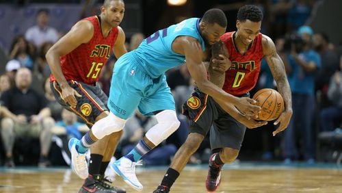 CHARLOTTE, NC - NOVEMBER 01: Jeff Teague #0 of the Atlanta Hawks tries to keep the ball from Kemba Walker #15 of the Charlotte Hornets during their game at Time Warner Cable Arena on November 1, 2015 in Charlotte, North Carolina. NOTE TO USER: User expressly acknowledges and agrees that, by downloading and or using this photograph, User is consenting to the terms and conditions of the Getty Images License Agreement. (Photo by Streeter Lecka/Getty Images)