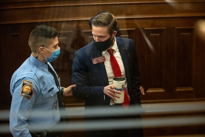 Georgia State Representative David Clark is removed from the state house chamber by Georgia State Trooper Justice after refusing to take Covid-19 tests in Atlanta, Georgia on January 26th. MANDATORY CREDIT: NATHAN POSNER