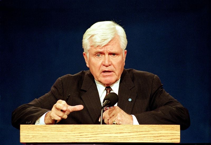 Retired Vice Adm. James Stockdale speaks during a debate in Atlanta in October 1992, when he was Ross Perot's running mate. His opening statement — “Who am I? Why am I here?” — became part of debate history. (AP Photo/Greg Gibson, File)