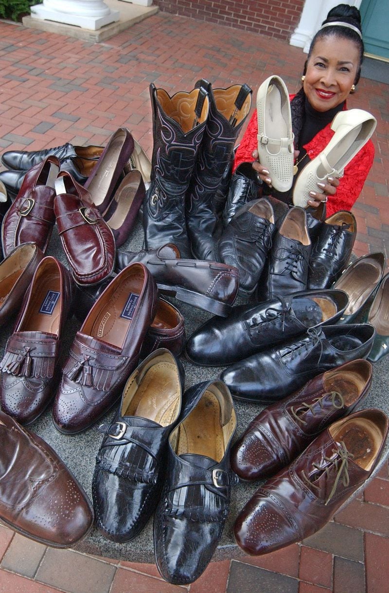 Xernona Clayton, who conceived of the idea for the footsteps exhibit, with dozens of shoes from those who fought for justice and equality. AJC FILE PHOTO