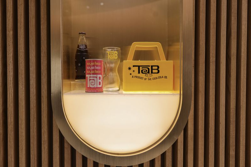Views of vintage Tab packaging shown at the Beverage Lab at The World of Coca Cola shown on Tuesday, Nov. 7, 2023. There is a short video showing a history of Tab at the museum and also the ability to taste the drink, which was discontinued for sale in 2020. (Natrice Miller/ Natrice.miller@ajc.com)