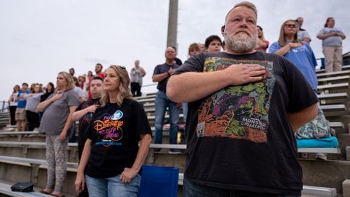 200918-Homer-James Luthi stands for the National Anthem before the beginning of the Banks County vs. East Jackson high school football game on Friday night Sept. 18, 2020 in Homer, Ga. Luthi, whose son is the drum major for the Banks County High School band, said he voted for Donald Trump four years ago and this year he is “the only option.” Ben Gray for the Atlanta Journal-Constitution