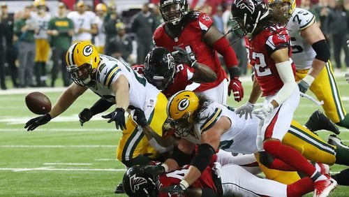 Falcons defenders swarm Packers fullback Aaron Ripkowski forcing a fumble recovered by Jalen Collins during the second quarter in the NFL football NFC Championship game on Sunday, Jan. 22, 2017, in Atlanta. Curtis Compton/ccompton@ajc.com