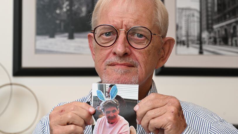 Charles Milne holding a photograph of his sister Leona Milne, who died without receiving CPR after she stopped breathing at her Marietta nursing home. Leona Milne had signed a do-not-resuscitate order, but a family lawsuit alleges that it was not done properly. (Hyosub Shin / Hyosub.Shin@ajc.com)