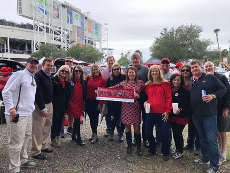 Georgia fan Robert Wolfe (far right) and his wife, J.J., will be unable to host their annual tailgate party on the fairgrounds outside TIAA Bank Field in Jacksonville as they've done for the past 20 years. (Shared photo)