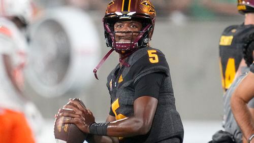 FILE -Arizona State quarterback Jaden Rashada warms up prior to an NCAA college football game against Oklahoma State Saturday, Sept. 9, 2023, in Tempe, Ariz. Former Florida recruit and current Georgia quarterback Jaden Rashada is suing Gators coach Billy Napier and the program’s top booster over a failed name, image and likeness deal worth nearly $14 million. The lawsuit filed Tuesday, May 21, 2024 in U.S. District Court in Pensacola, Fla. (AP Photo/Ross D. Franklin, File)