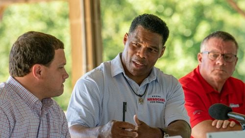 September 13, 2022 Alto - Republican Senate nominee Herschel Walker (center) speaks as he and Georgia Agriculture Commissioner candidate, State Sen. Tyler Harper (left) join with local farmers during a roundtable at Jaemor Farms in Alto on Tuesday, September 103, 2022.(Hyosub Shin / Hyosub.Shin@ajc.com)
