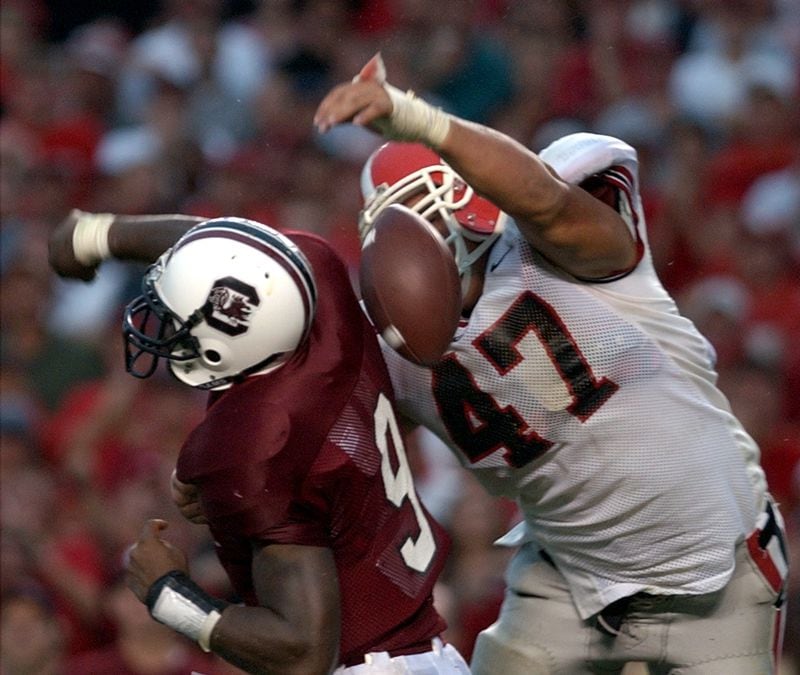 UGA's David Pollack strips the ball from South Carolina quarterback Corey Jenkins in 2002 in the end zone and scores a memorable touchdown.