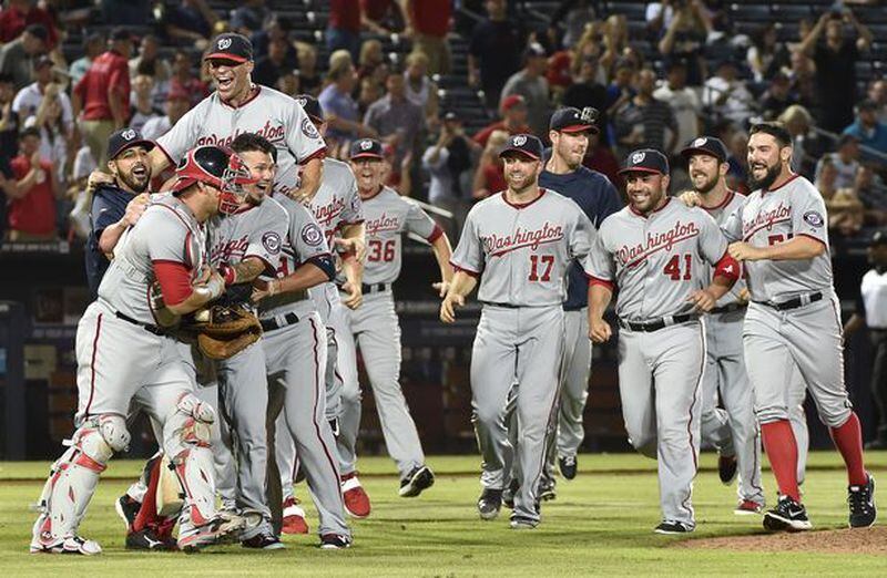 The Nationals celebrated winning the NL East title Tuesday night at Turner Field, the latest indignation for the skidding Braves.