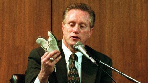 Joe Burton, medical examiner for Cobb, Gwinnett, DeKalb, Clayton, Douglas, Paulding and Rockdale counties during the 1980s and 1990s, testifies during a trial in 1997. (AJC file image)
