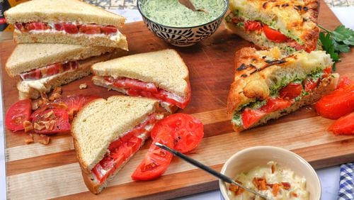 Put a new spin on an old summer favorite with Heirloom Tomato Sandwich with Bacon Mayonnaise (left side upper), Improved Classic Tomato Sandwich (left side lower) and Grilled Tomato and Chimichurri Sandwich (right side). (Styling by Kate Williams / Chris Hunt for the AJC)