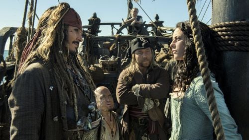 Johnny Depp portrays Jack Sparrow, left, and Kaya Scodelario portrays Carina Smyth, right, in “Pirates of the Caribbean: Dead Men Tell No Tales.” Contributed by Peter Mountain/Disney