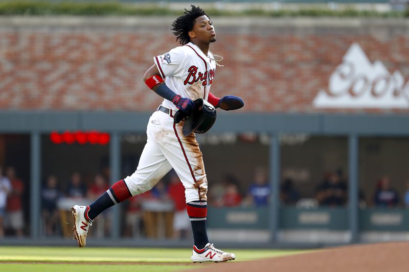 Ronald Acuna Jr.  jogs off the field after being caught stealing during the first inning. (Photo by Kevin C. Cox/Getty Images)