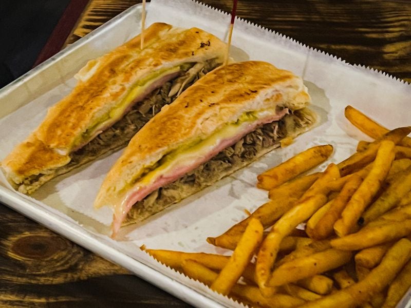 Pisco Latin Kitchen's Cuban sandwich is notable for its bread, which is crusty, but very light. Henri Hollis/henri.hollis@ajc.com