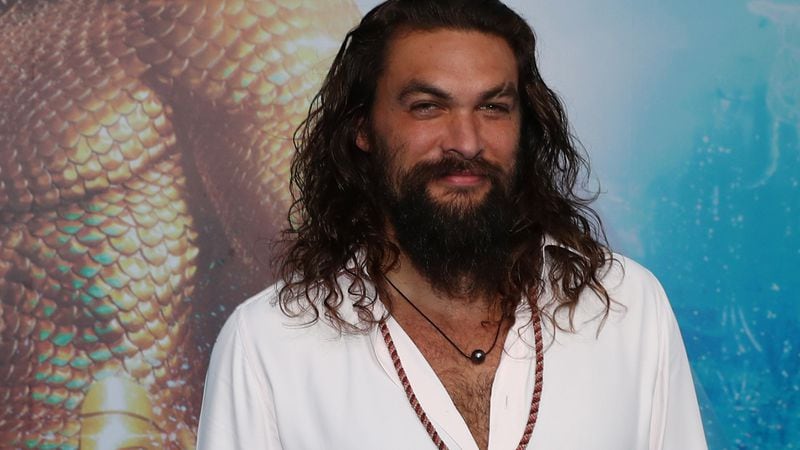 Jason Momoa poses at the Australian premiere of Aquaman on December 18, 2018 in Gold Coast, Australia. A Girl Scout in Colorado has rebranded Samoas to honor the actor, and sell more cookies.