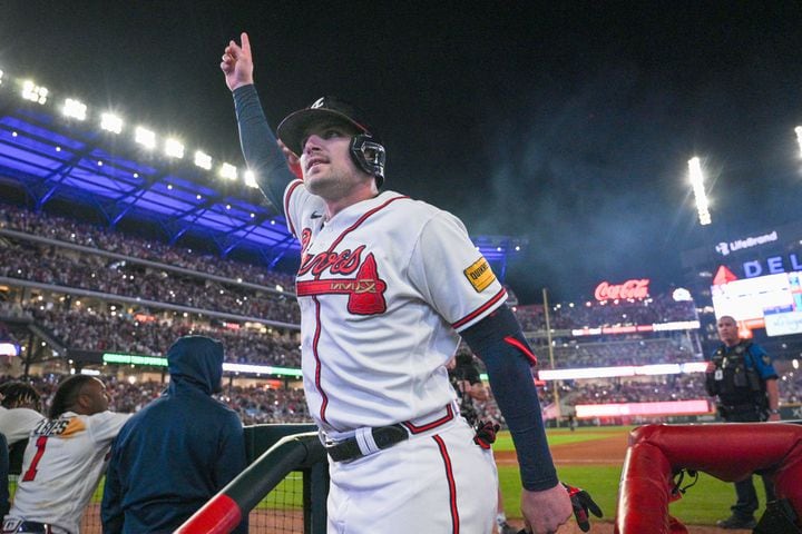 Atlanta Braves’ Austin Riley acknowledges the crowd after his two-run home run against the Philadelphia Phillies during the eighth inning of NLDS Game 2 in Atlanta on Monday, Oct. 9, 2023.  The Braves won 5-4. (Hyosub Shin / Hyosub.Shin@ajc.com)