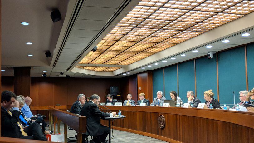 The Georgia Senate Judiciary Committee hears testimony on the Hidden Predator Act. Author Rep. Jason Spencer, R-Woodbine, faces the panel as, seated to his left, defense attorney Stevan Millar, criticizes the proposal. Observers behind them include people who say they were sexually abused as children. March 15, 2018, Atlanta, TY TAGAMI / TTAGAMI@AJC.COM