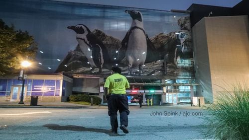 Two men have broken into at least 10 cars inside the Georgia Aquarium parking deck since June 15 by busting windows or popping locks.