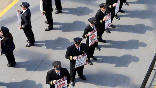 Delta Air Lines pilots are seen picketing at the south terminal of Hartsfield-Jackson International Airport Thursday, March 10, 2022. The pilots are members of the Air Line Pilots Association at Delta and protesting fatiguing schedules. (Daniel Varnado/For the Atlanta Journal-Constitution)