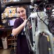Mechanic Lizzy Thomson works at University Bicycles in Boulder, Colo., Tuesday, April 30, 2024. Bike stores quickly sold out of their stock early in the pandemic and had trouble restocking because of supply chain issues. Now, inventory is back, but demand has waned. (AP Photo/Thomas Peipert)