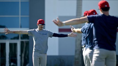 Braves starting pitcher Max Fried (left) warms up with other pitchers during spring training baseball workouts at CoolToday Park, Wednesday, February, 14, 2024, in North Port, Florida. (Hyosub Shin / Hyosub.Shin@ajc.com)