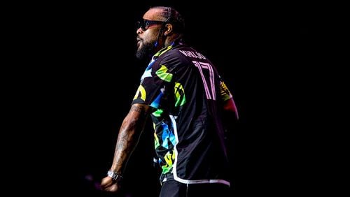 Goodie Mob member Khujo dons the Atlanta United's new kit while performing on stage for the city's 50th Anniversary hip-hop concert at Lakewood Amphitheater Sunday, August 13, 2023. The franchise confirmed Monday that the kit is authentic. (KYMANI YASIR CULMER/Contributor