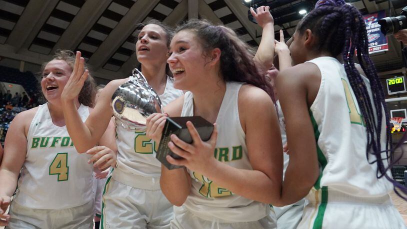 Buford High School players celebrate their win over Kell at the Class AAAA girls title basketball game at the Macon Centreplex, Friday March 6, 2020, in Macon. Tami Chappell for the Atlanta Journal Constitution