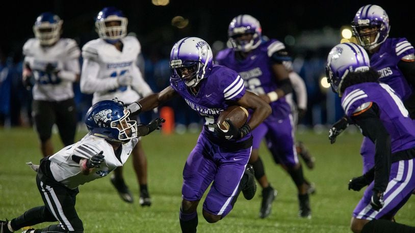 Miller Grove's Cayman Spalding carries the ball for a touchdown during a GHSA high school football game between Stephenson High School and Miller Grove High School at James R. Hallford Stadium in Clarkston, GA., on Friday, Oct. 8, 2021. (Photo/Jenn Finch)