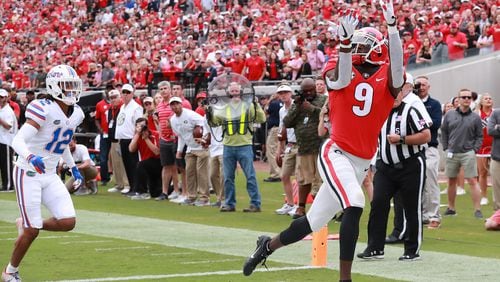 Georgia wide receiver Jeremiah Holloman gets past Florida defensive back C.J. McWilliams for a touchdown reception in the first quarter Saturday, Oct 27, 2018, in Jacksonville.