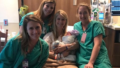 Nurse Kinsey Close (center) with her nursing colleagues after delivering her third child.