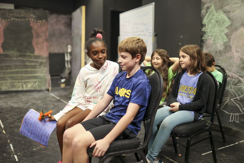 Elementary school students give a sneak peak at their play during a "school break play days” at the Alliance Theatre, Tuesday, Nov. 7, 2023, in Atlanta. Several Atlanta organizations have started to offer "camps" for kids when school is out and parents have to work. (Jason Getz / Jason.Getz@ajc.com)