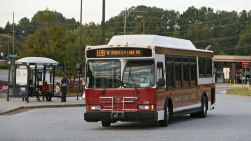 This 2013 file photo shows a Gwinnett County Transit bus pulls away from the transit center in Duluth. BOB ANDRES / BANDRES@AJC.COM