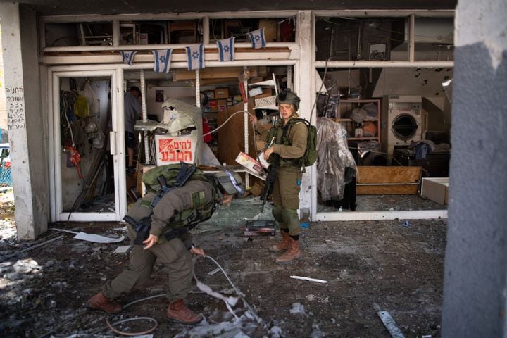 Israeli security forces clean up a site in Ramat Gan, Israel, struck by rocket fire from the Gaza Strip, May 15, 2021. (Corinna Kern/The New York Times)