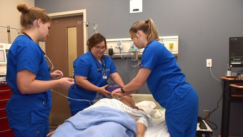 University of North Georgia nursing students work in the new simulation lab inside the renovated Health Sciences building on its Gainesville campus. The simulation lab resembles real hospital rooms including a labor and delivery room. All are equipped with human-style simulators that can talk, blink, and cry. PHOTO CONTRIBUTED.