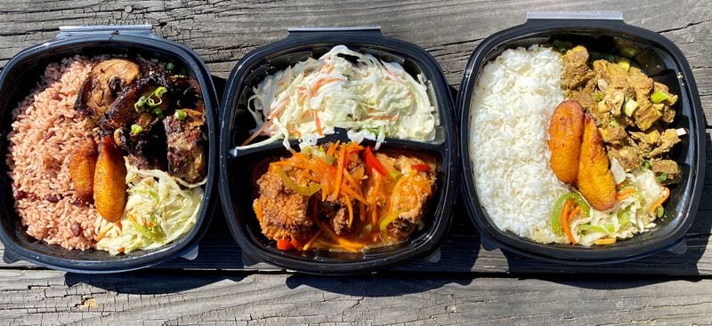A takeout feast from Spicy Hill includes jerk chicken, fried chicken and curry goat. 
Wendell Brock for The Atlanta Journal-Constitution
