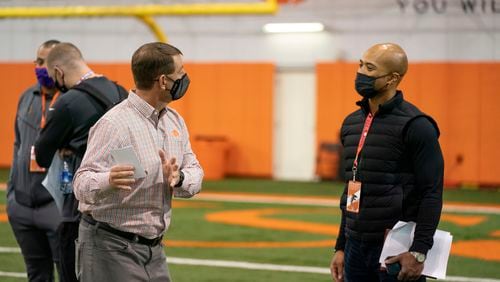 Falcons general manager Terry Fontenot talking with Clemson coach Dabo Swinney at quarterback Trevor Lawrence's Pro Day workout on Friday, February 12, 2021. (Photo credit:  Courtesy of David Platt/Clemson Athletics)